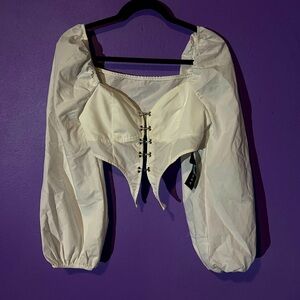 Long Sleeve corset type top with front closure.